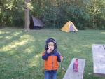 eating a donught with one hand and playing with marshmellow sticks in the other...
