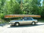Our junker tripping car looks small with this boat on top.