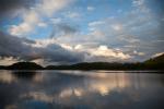 Clearing skies at island campsite on That Man Lake.