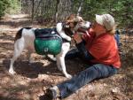 Katy, with fully loaded dog pack, enjoys a moment with Heidi.