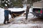 Nicole and Mike Nelson unload the dogsled at the Clearwater Lake landing.
