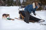 Nicole prepares the dogsled as Titus comes to help.