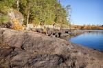 Rocky northeast shoreline of island campsite on Gabbro Lake.
